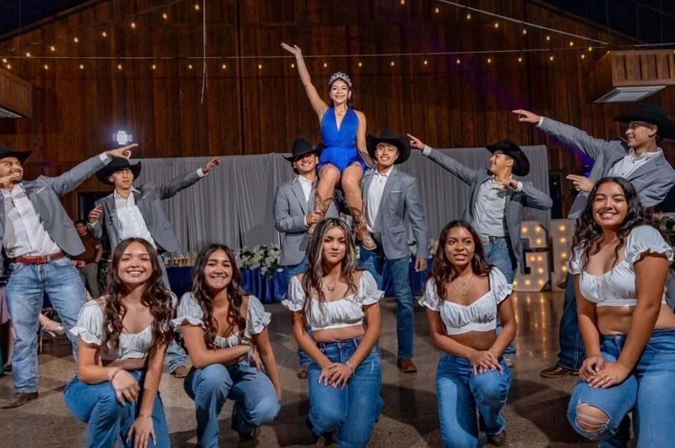A quinceañera court performing a choreographed surprise dance