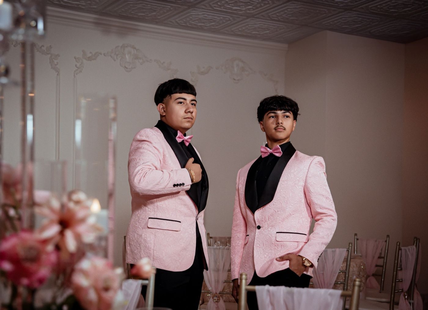Pink formal jackets on two chambelanes