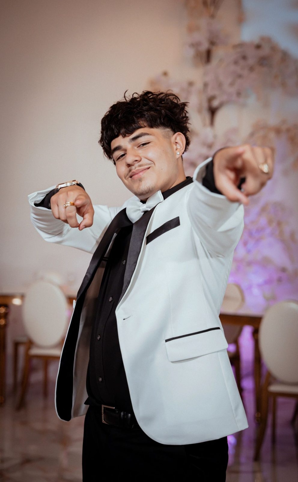 White formal suit worn at a quinceañera
